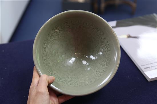 A large Chinese moulded Yaozhou celadon bowl, Jin dynasty (1115-1234), diameter 20.2cm
